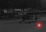 Image of Piper Cub flying Avenue des Champs Elysees Paris France, 1944, second 46 stock footage video 65675079487
