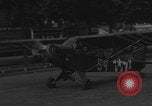 Image of Piper Cub flying Avenue des Champs Elysees Paris France, 1944, second 47 stock footage video 65675079487