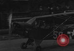 Image of Piper Cub flying Avenue des Champs Elysees Paris France, 1944, second 48 stock footage video 65675079487