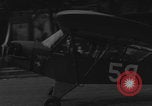 Image of Piper Cub flying Avenue des Champs Elysees Paris France, 1944, second 49 stock footage video 65675079487