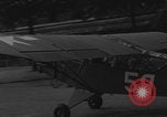 Image of Piper Cub flying Avenue des Champs Elysees Paris France, 1944, second 50 stock footage video 65675079487