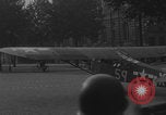 Image of Piper Cub flying Avenue des Champs Elysees Paris France, 1944, second 53 stock footage video 65675079487