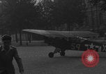 Image of Piper Cub flying Avenue des Champs Elysees Paris France, 1944, second 54 stock footage video 65675079487