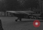 Image of Piper Cub flying Avenue des Champs Elysees Paris France, 1944, second 55 stock footage video 65675079487