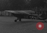 Image of Piper Cub flying Avenue des Champs Elysees Paris France, 1944, second 56 stock footage video 65675079487