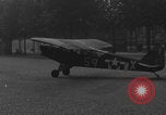 Image of Piper Cub flying Avenue des Champs Elysees Paris France, 1944, second 57 stock footage video 65675079487