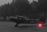 Image of Piper Cub flying Avenue des Champs Elysees Paris France, 1944, second 58 stock footage video 65675079487