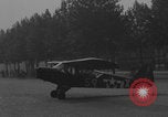 Image of Piper Cub flying Avenue des Champs Elysees Paris France, 1944, second 59 stock footage video 65675079487