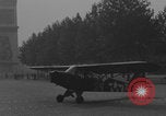 Image of Piper Cub flying Avenue des Champs Elysees Paris France, 1944, second 60 stock footage video 65675079487