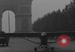 Image of Piper Cub flying Avenue des Champs Elysees Paris France, 1944, second 62 stock footage video 65675079487
