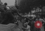 Image of US soldier kisses women girls Paris France, 1944, second 16 stock footage video 65675079491