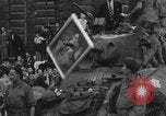 Image of FFI fighters playing with Hitler portrait Paris France, 1944, second 42 stock footage video 65675079512