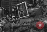 Image of FFI fighters playing with Hitler portrait Paris France, 1944, second 47 stock footage video 65675079512