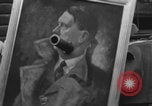Image of FFI fighters playing with Hitler portrait Paris France, 1944, second 49 stock footage video 65675079512