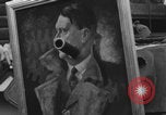 Image of FFI fighters playing with Hitler portrait Paris France, 1944, second 50 stock footage video 65675079512