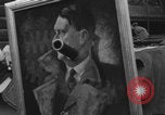 Image of FFI fighters playing with Hitler portrait Paris France, 1944, second 51 stock footage video 65675079512