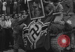 Image of FFI fighters playing with Hitler portrait Paris France, 1944, second 52 stock footage video 65675079512