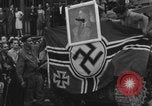Image of FFI fighters playing with Hitler portrait Paris France, 1944, second 55 stock footage video 65675079512