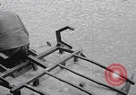 Image of US soldier driving Japanese suicide motorboat Japan, 1945, second 5 stock footage video 65675079539