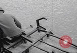 Image of US soldier driving Japanese suicide motorboat Japan, 1945, second 6 stock footage video 65675079539