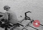 Image of US soldier driving Japanese suicide motorboat Japan, 1945, second 7 stock footage video 65675079539