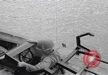 Image of US soldier driving Japanese suicide motorboat Japan, 1945, second 8 stock footage video 65675079539