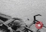 Image of US soldier driving Japanese suicide motorboat Japan, 1945, second 9 stock footage video 65675079539