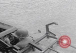 Image of US soldier driving Japanese suicide motorboat Japan, 1945, second 11 stock footage video 65675079539