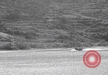 Image of US soldier driving Japanese suicide motorboat Japan, 1945, second 14 stock footage video 65675079539