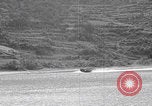 Image of US soldier driving Japanese suicide motorboat Japan, 1945, second 15 stock footage video 65675079539