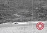 Image of US soldier driving Japanese suicide motorboat Japan, 1945, second 18 stock footage video 65675079539