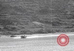 Image of US soldier driving Japanese suicide motorboat Japan, 1945, second 19 stock footage video 65675079539