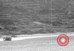 Image of US soldier driving Japanese suicide motorboat Japan, 1945, second 21 stock footage video 65675079539