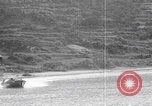 Image of US soldier driving Japanese suicide motorboat Japan, 1945, second 22 stock footage video 65675079539
