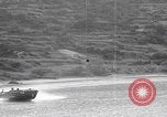 Image of US soldier driving Japanese suicide motorboat Japan, 1945, second 23 stock footage video 65675079539