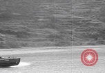 Image of US soldier driving Japanese suicide motorboat Japan, 1945, second 24 stock footage video 65675079539