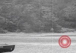 Image of US soldier driving Japanese suicide motorboat Japan, 1945, second 25 stock footage video 65675079539