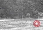 Image of US soldier driving Japanese suicide motorboat Japan, 1945, second 28 stock footage video 65675079539