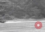Image of US soldier driving Japanese suicide motorboat Japan, 1945, second 30 stock footage video 65675079539