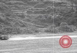Image of US soldier driving Japanese suicide motorboat Japan, 1945, second 32 stock footage video 65675079539