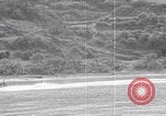 Image of US soldier driving Japanese suicide motorboat Japan, 1945, second 33 stock footage video 65675079539