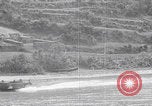 Image of US soldier driving Japanese suicide motorboat Japan, 1945, second 36 stock footage video 65675079539