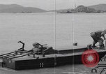 Image of US soldier driving Japanese suicide motorboat Japan, 1945, second 39 stock footage video 65675079539