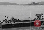 Image of US soldier driving Japanese suicide motorboat Japan, 1945, second 40 stock footage video 65675079539