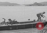 Image of US soldier driving Japanese suicide motorboat Japan, 1945, second 41 stock footage video 65675079539