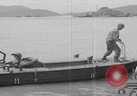 Image of US soldier driving Japanese suicide motorboat Japan, 1945, second 42 stock footage video 65675079539
