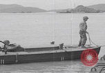 Image of US soldier driving Japanese suicide motorboat Japan, 1945, second 43 stock footage video 65675079539