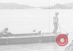 Image of US soldier driving Japanese suicide motorboat Japan, 1945, second 44 stock footage video 65675079539
