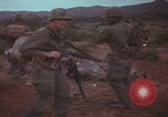 Image of Operation Wallowa US 1st Brigade 7th Cavalry walking Vietnam, 1967, second 33 stock footage video 65675079543