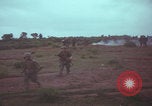 Image of Operation Wallowa US 1st Brigade 7th Cavalry walking Vietnam, 1967, second 50 stock footage video 65675079543